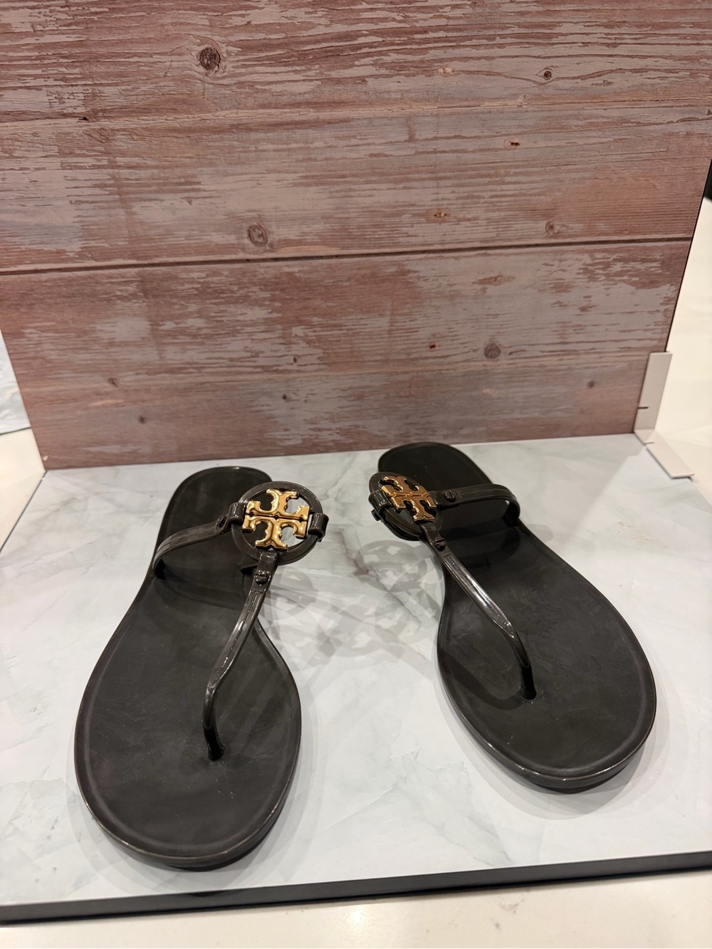 Tory Burch Black Jelly Thong Sandals with Gold Logo Emblem